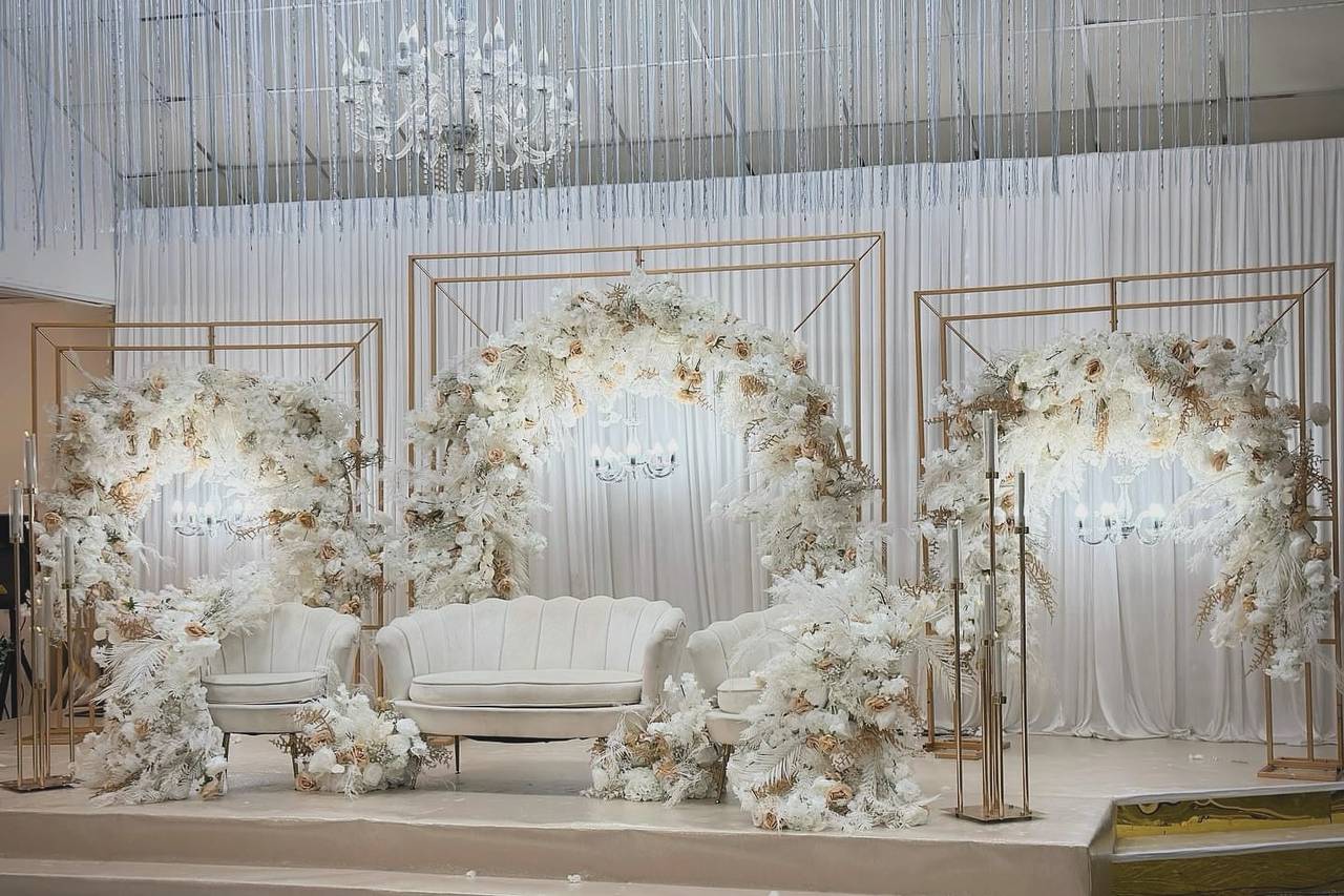 White floral arch stage